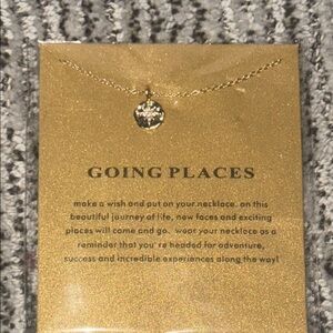 Gold “going places” compass necklace